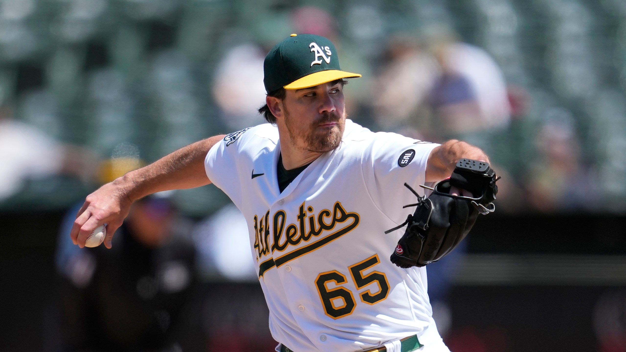 FILE - Oakland Athletics' Trevor May throws during a baseball game against the Houston Astros in Oakland, Calif., Saturday, May 27, 2023. Oakland A's reliefe pitcher Trevor May has announced his retirement from baseball, and in the process, implored owner John Fisher to sell the team. (AP Photo/Jeff Chiu, File)