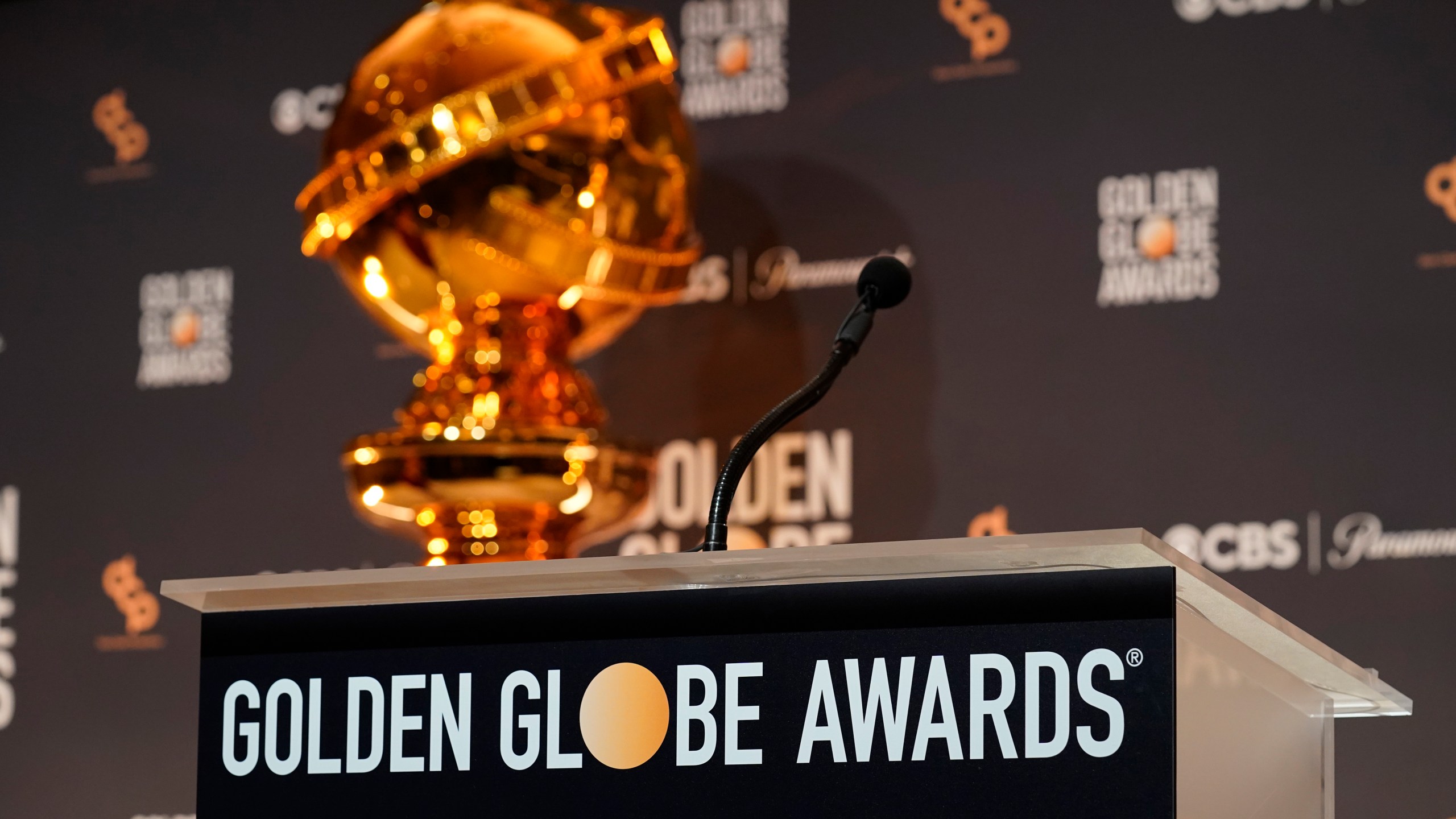 A replica of a Golden Globe statue appear behind the podium at the nominations for the 81st Golden Globe Awards at the Beverly Hilton Hotel on Monday, Dec. 11, 2023, in Beverly Hills, Calif. The 81st Golden Globe Awards will be held on Sunday, Jan. 7, 2024. (AP Photo/Chris Pizzello)