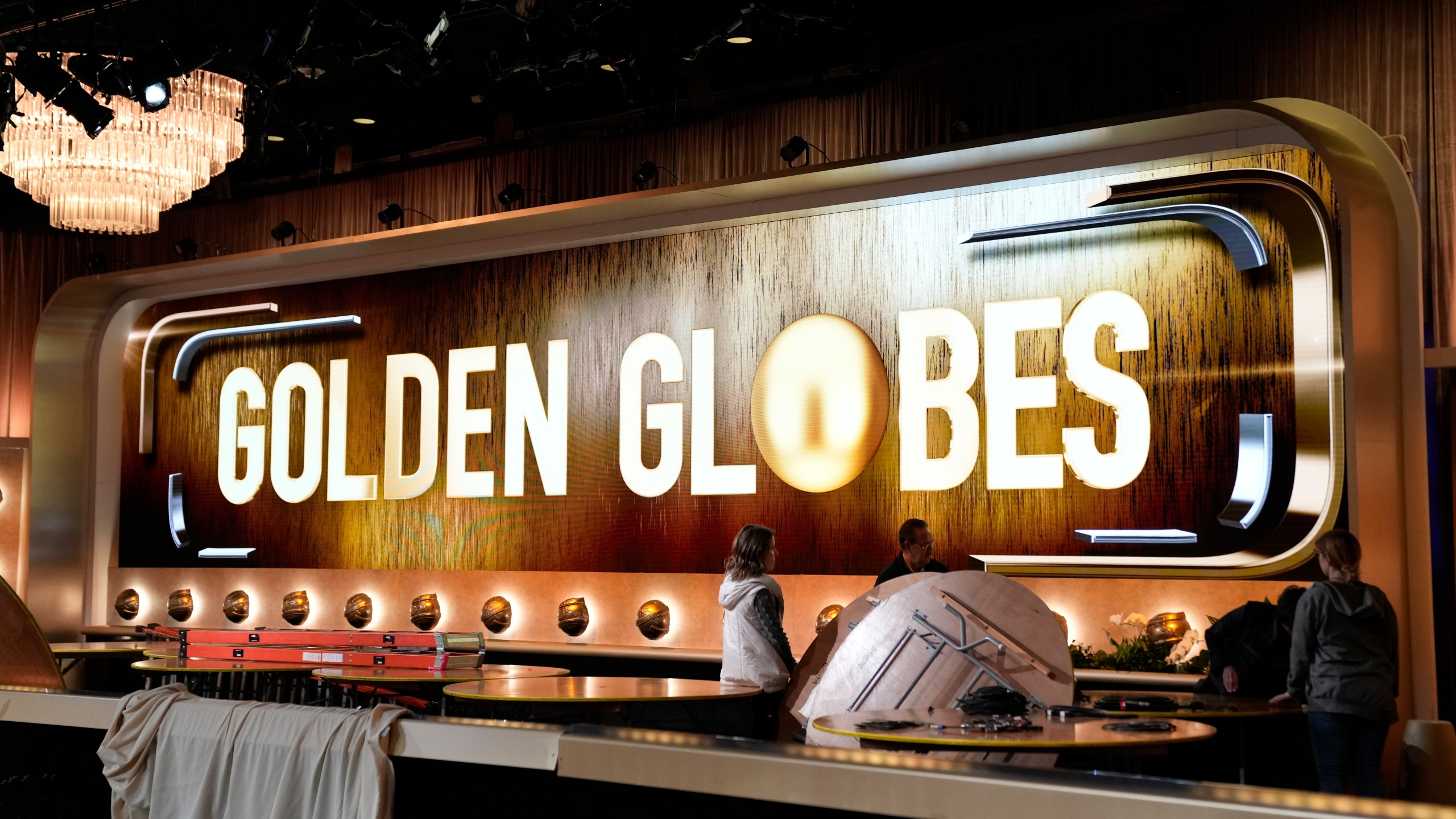 Crews set up a ballroom during the Golden Globe Awards Press Preview at the Beverly Hilton on Thursday, Jan. 4, 2024, in Beverly Hills, Calif. (AP Photo/Ashley Landis)